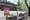 Un site vide entouré d'une barrière avec une affiche "Passage interdit".
